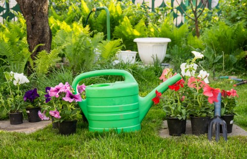 Professionally insured rubbish company working carefully around garden features